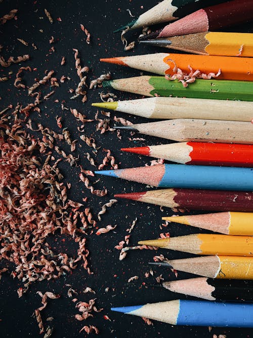 A Sharpened Colored Pencils on a Black Surface