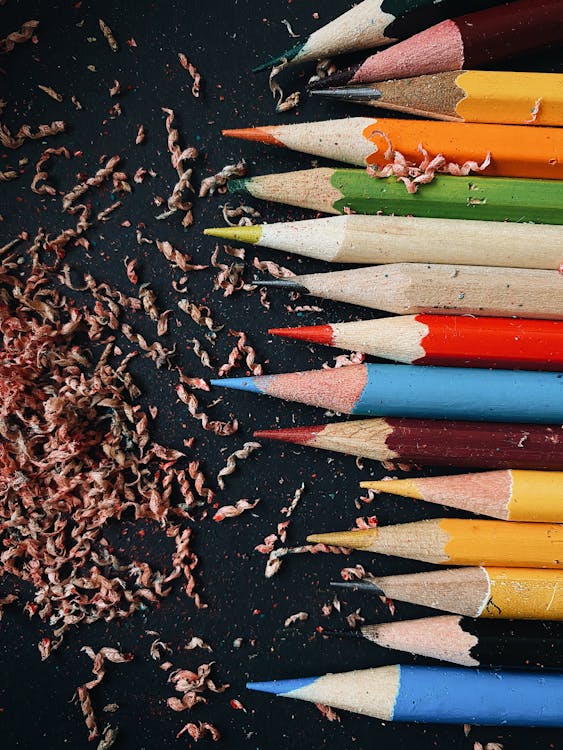 Free A Sharpened Colored Pencils on a Black Surface Stock Photo