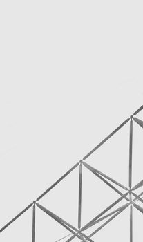 Minimalistic geometric metal framework against a grey background. Perfect for design themes.