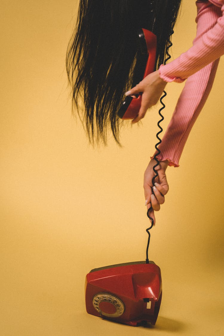 Woman Holding Rotary Phone