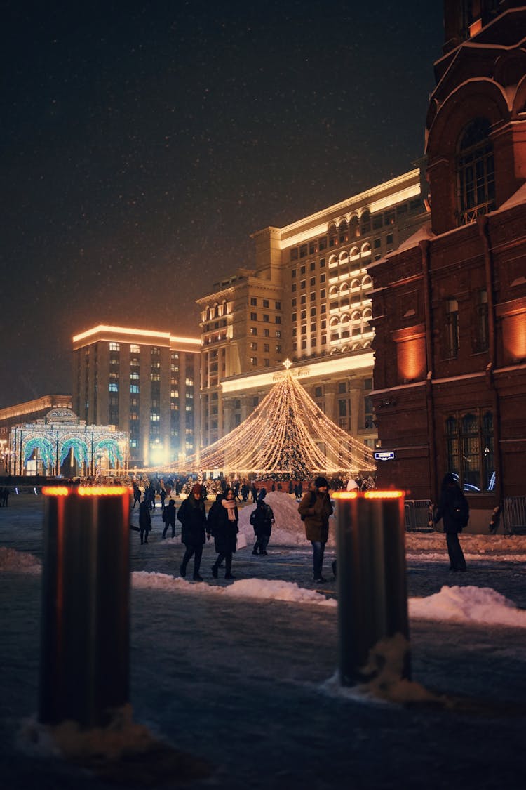 Street With Christmas Decorations And Pedestrians