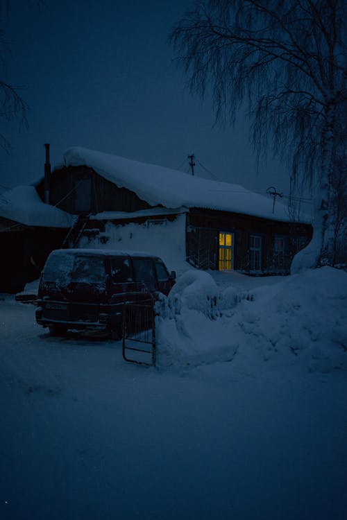 Free A House Covered With Snow during Night Time Stock Photo
