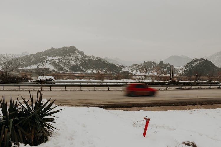 Car On Highway In Winter