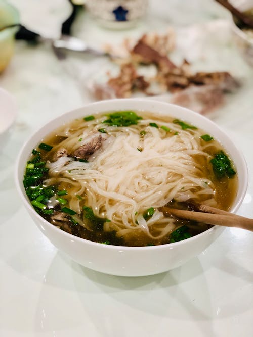 White Ceramic Bowl with Noodles and Chopsticks