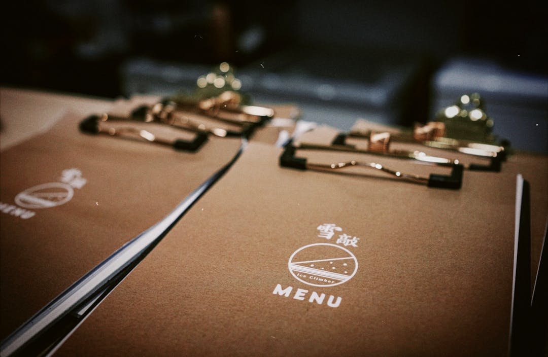 Stylish clipboards holding restaurant menus, perfect for dining theme.