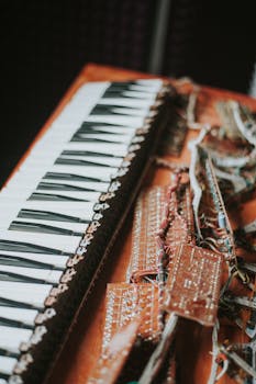 Disassembled electronic keyboard showing internal circuits and wires for artistic and technical interest.