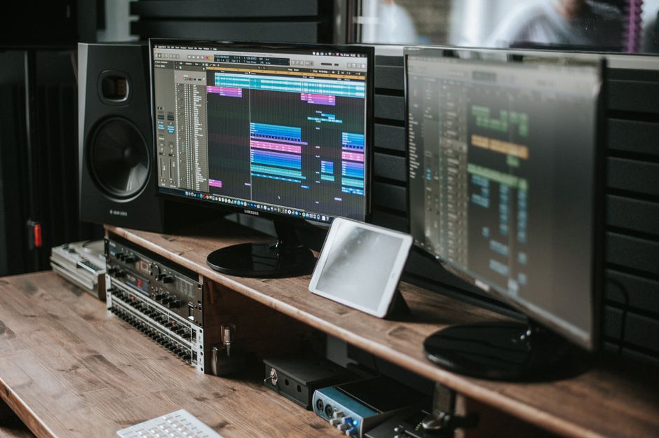 Best Air Quality Monitors for Home Health in 2025: Top Picks & Tips Modern music studio setup featuring dual monitors displaying audio editing software on a wooden desk.