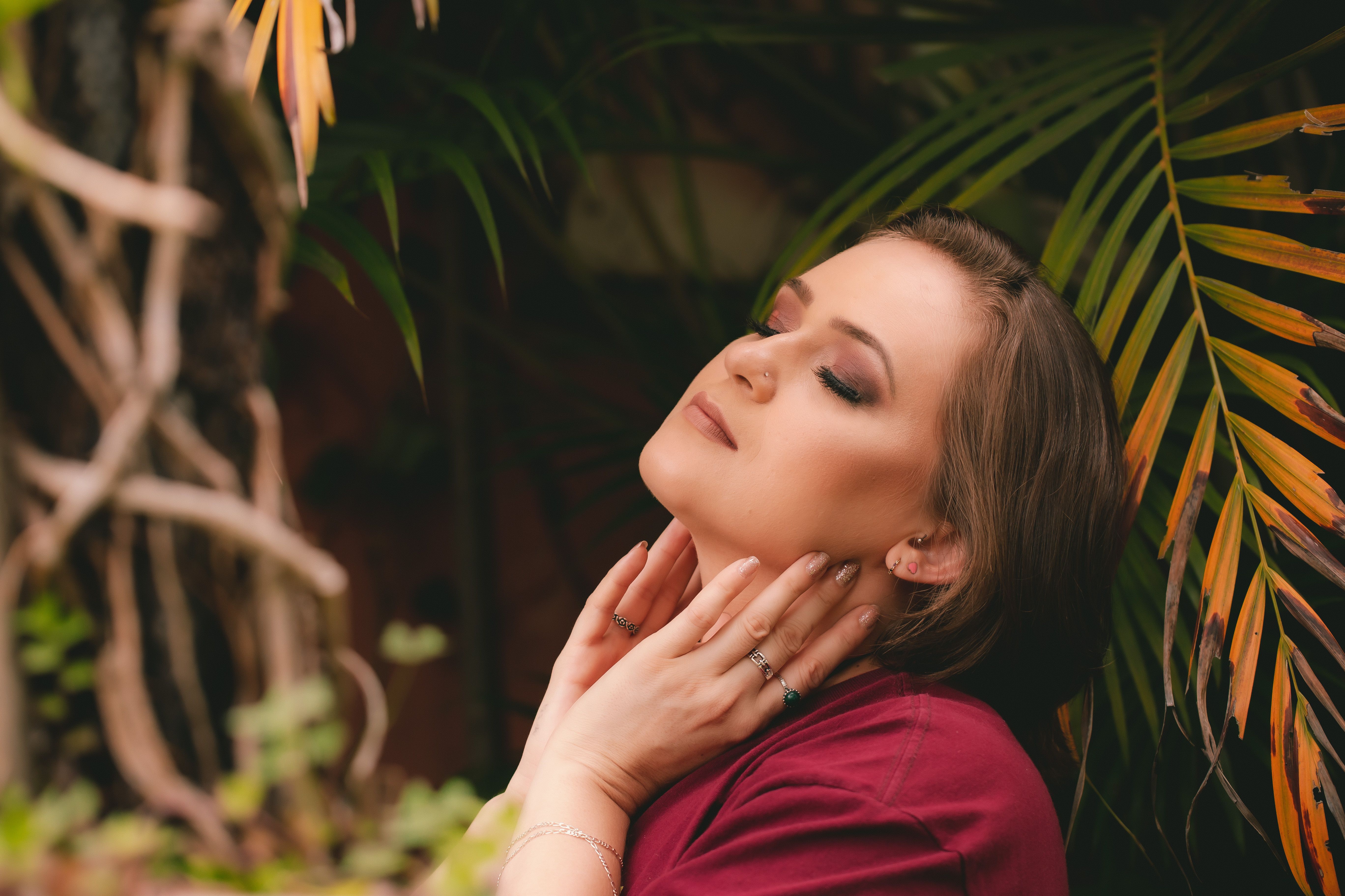 Woman Holding Her Neck while Eyes Closed · Free Stock Photo