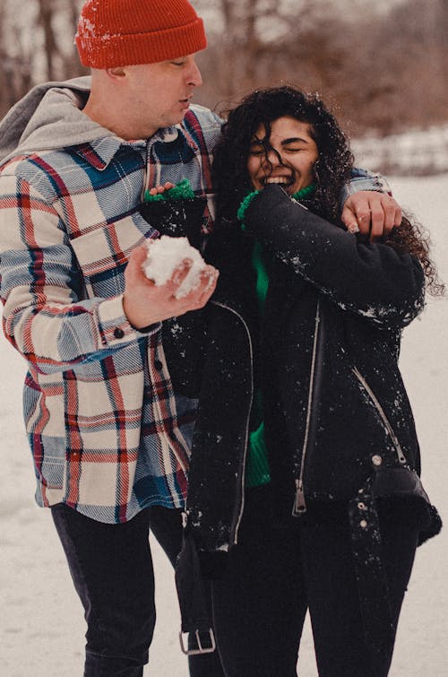 Cute Couple Having Fun Outside in Winter 