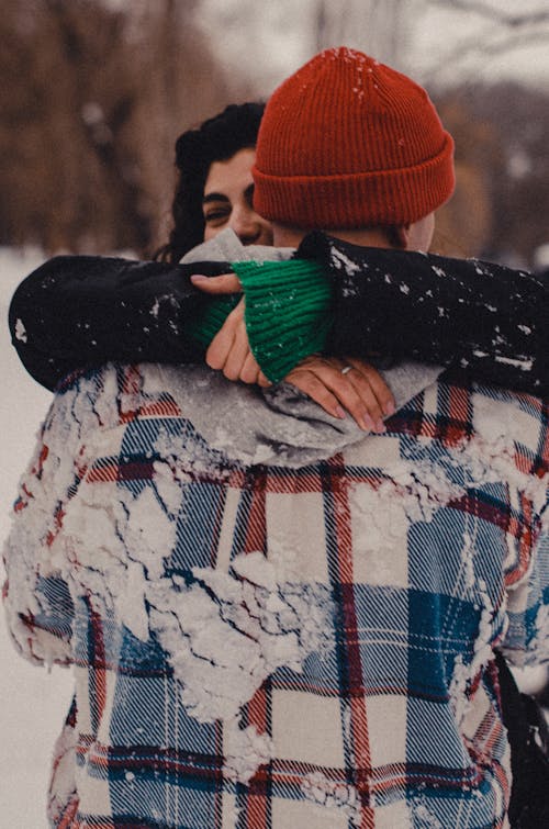 Woman and Man Hugging in Winter 