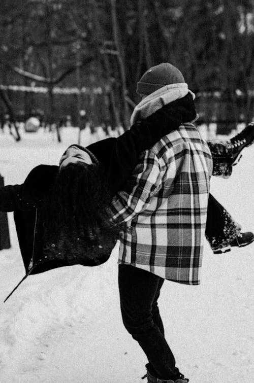 Cute Couple Having Fun Outside in Winter 