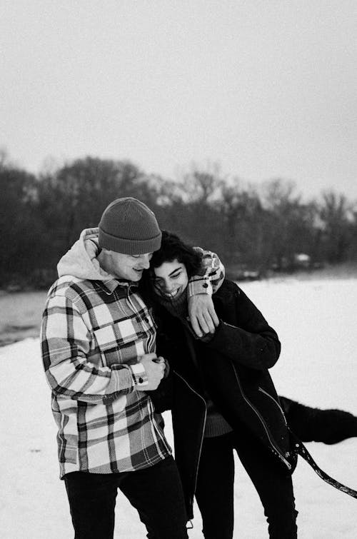 Cute Couple Hugging Outside in Winter 