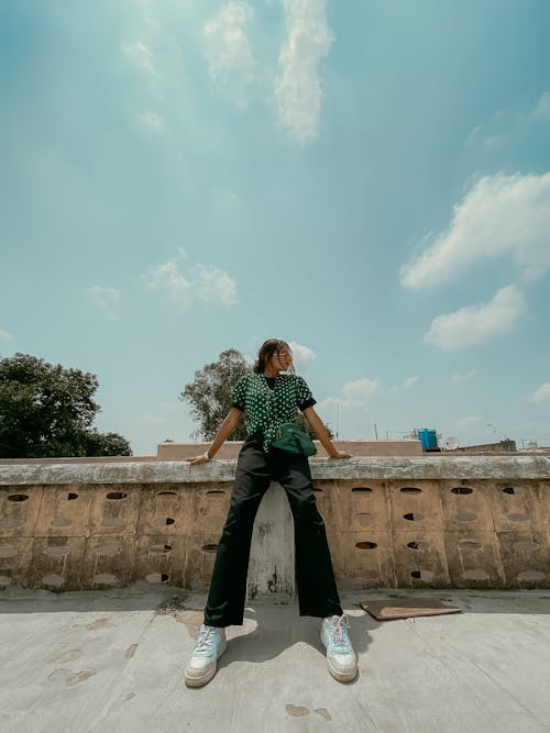 Young Woman in a Fashionable Outfit Posing Outdoors 