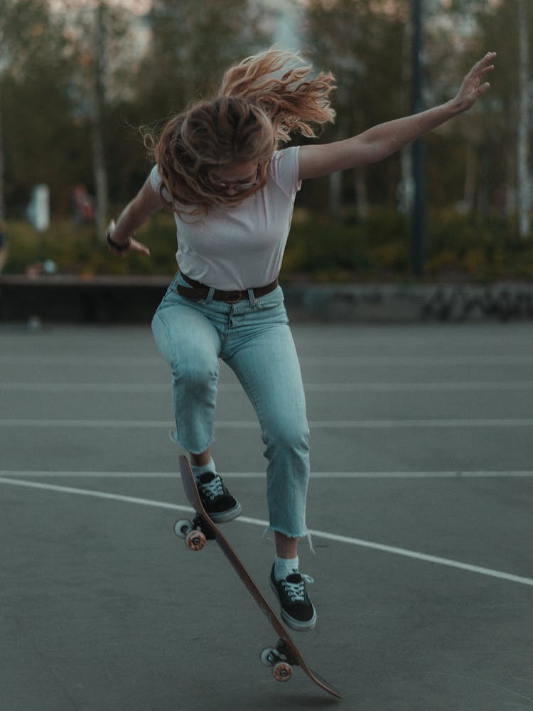 A Woman Doing Skateboard Tricks