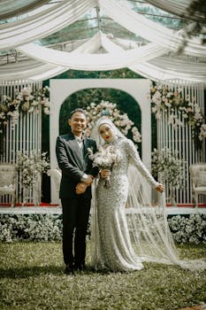 Romantic outdoor wedding photo with Asian couple in beautiful attire.