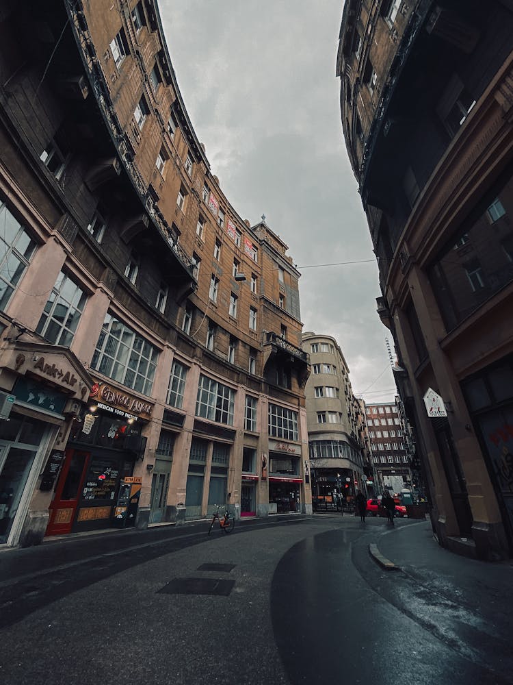 A Curved Street Between Curved Buildings