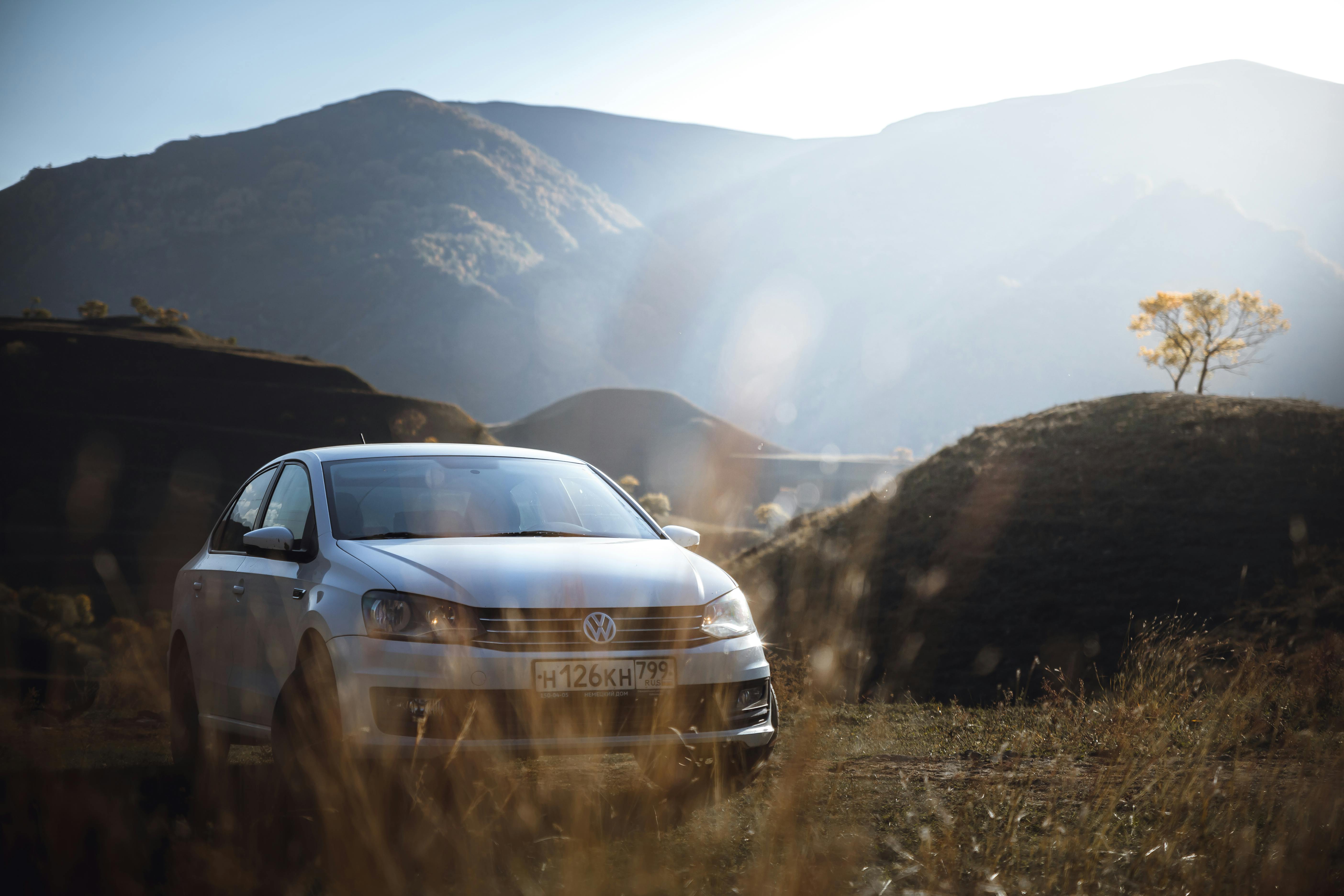 A White Car with Mountain Background · Free Stock Photo