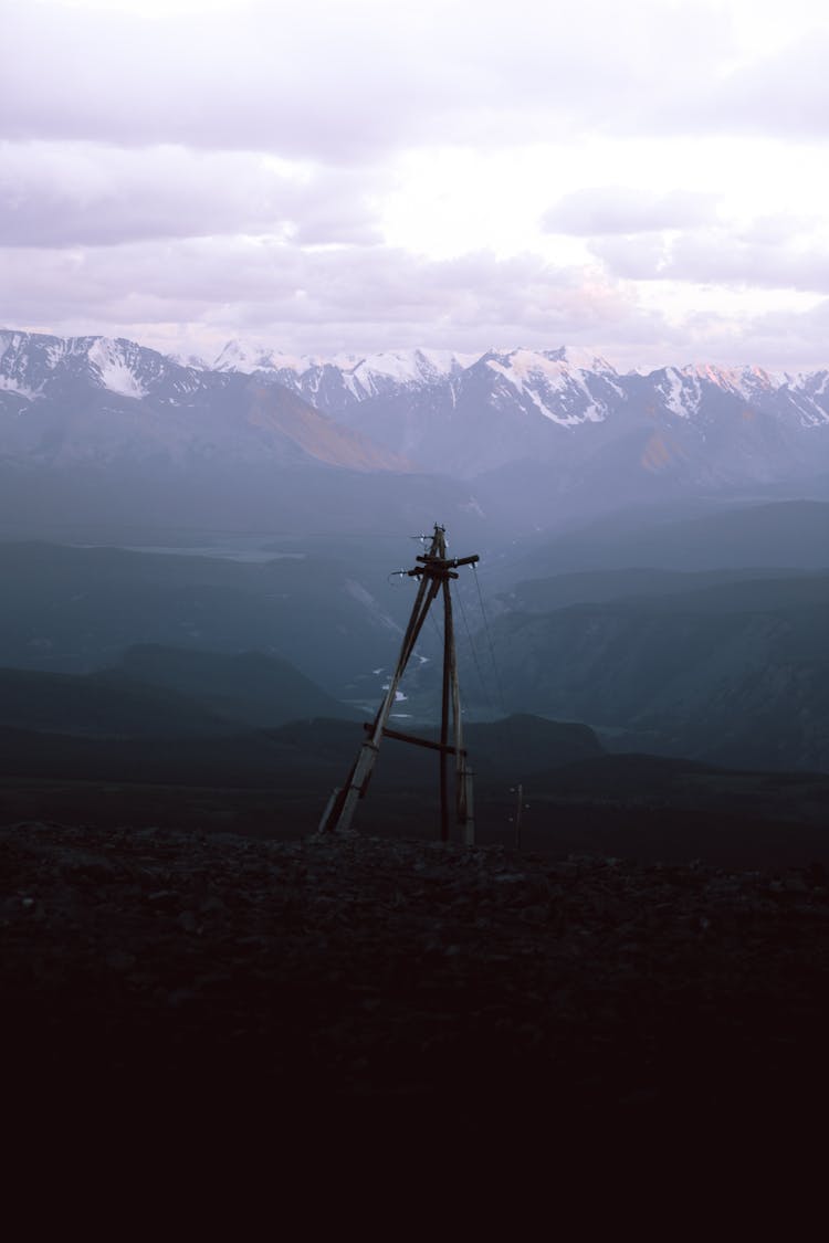 Electric Lines Near Snow-Covered Mountains