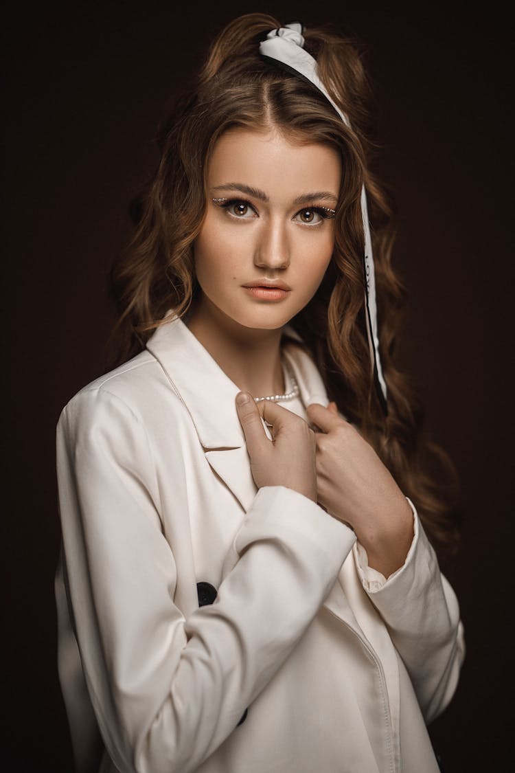 Pretty Young Woman With Tied Blond Hair And In Classic Large White Jacket