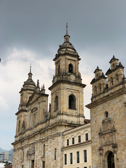 Free Vertical shot of a beautiful cathedral in Bogotá, showcasing its classic architecture against a cloudy sky. Stock Photo