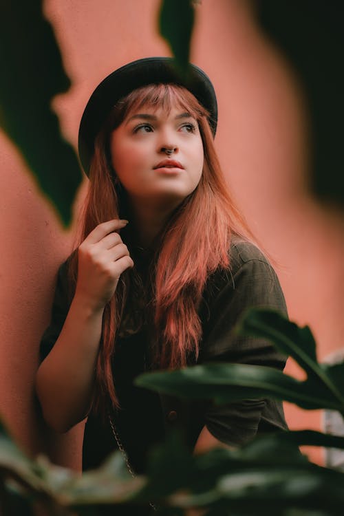 Selective Focus Photo of Woman With Red Hair Looking Up