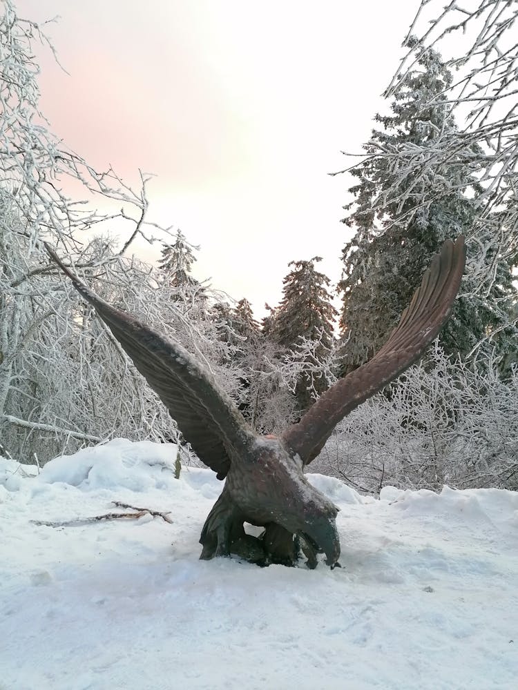 Golden Eagle Statue On Snow Covered Ground