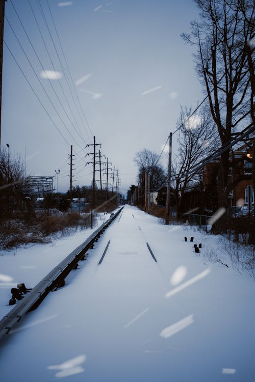 Photo of a Railway Track Covered in Snow