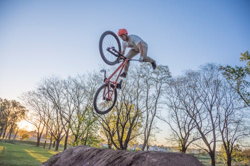 A Man Riding a Bicycle in Midair