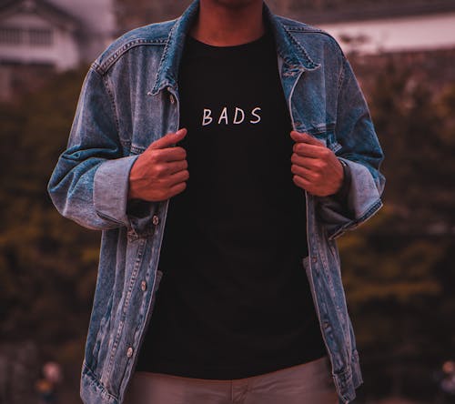 Man Wearing Black Bads Crew-neck Shirt Under Blue Denim Jacket