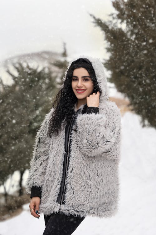 Photograph of a Woman in a Fur Coat Smiling