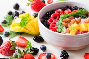 Berry breakfast bowl with mango and almonds