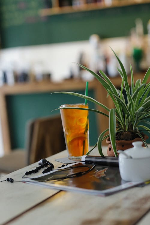 Free Iced Tea with Lemon Standing on Table in Cafe Stock Photo