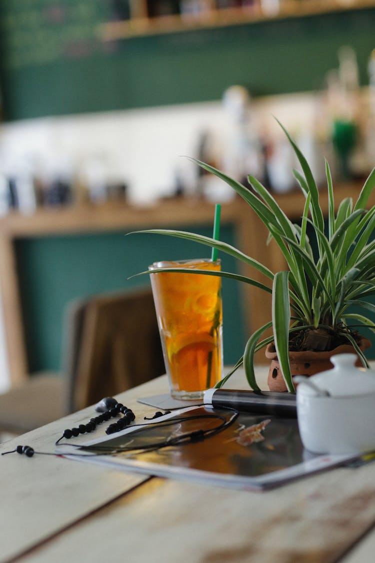 Iced Tea With Lemon Standing On Table In Cafe