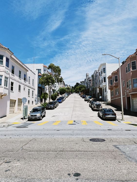 Cars Parked on Side of the Road Near Buildings · Free Stock Photo