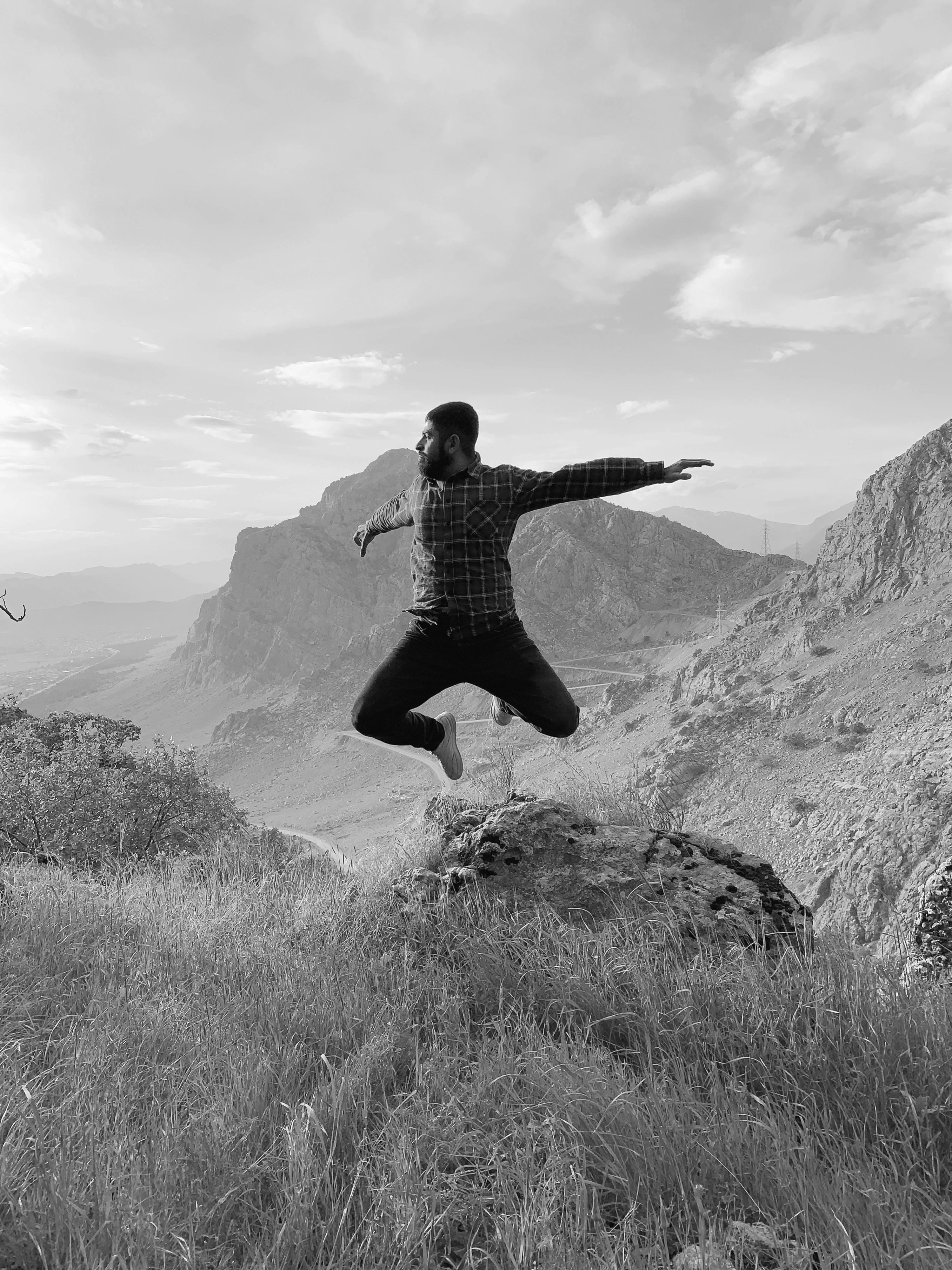 Man Striking Pose while Jumping into Water · Free Stock Photo