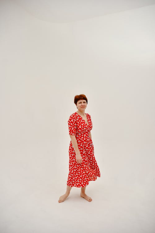 Red-Haired Woman in Red Floral Dress