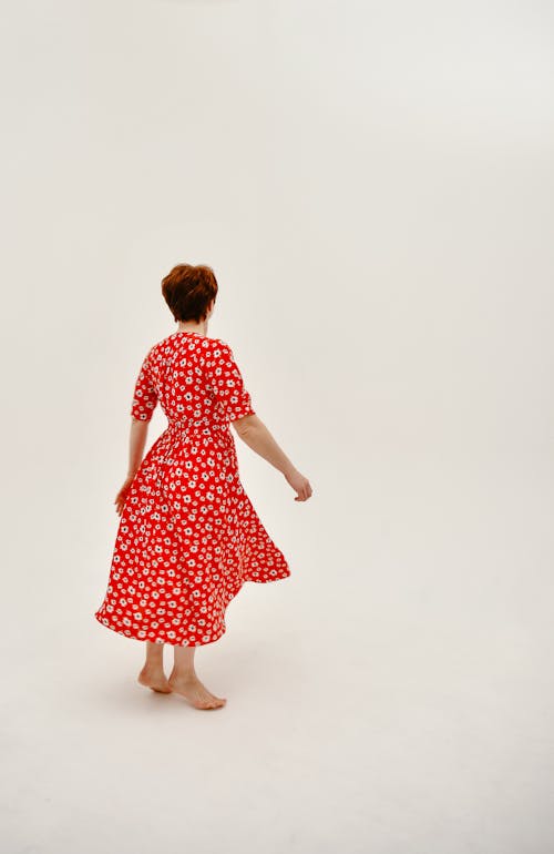 Red-Haired Woman in Red Floral Dress