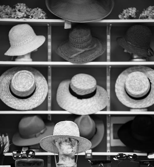Free Grayscale Photo of Hats on Display Stock Photo