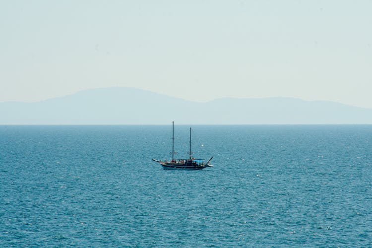 Boat In The Middle Of The Blue Sea