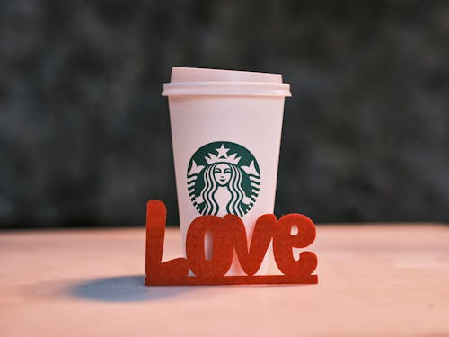 A Red Love Text near a Starbucks Coffee