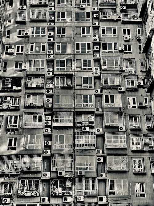 Grayscale Photo of an Apartment Building
