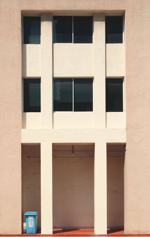Free Brown Concrete Building With Glass Window Stock Photo