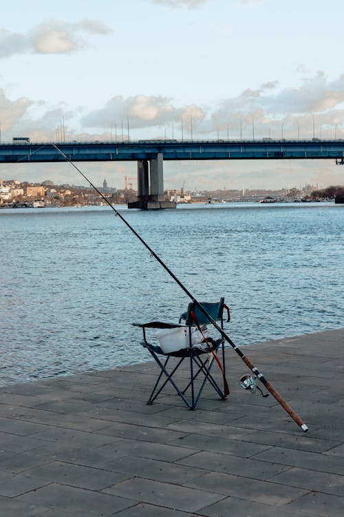 Fishing Rod and Folding Chair Near the Sea