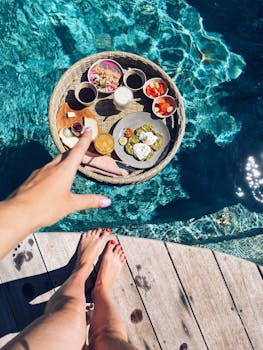 A delightful floating breakfast in a sunny tropical pool, perfect for a luxurious vacation experience.