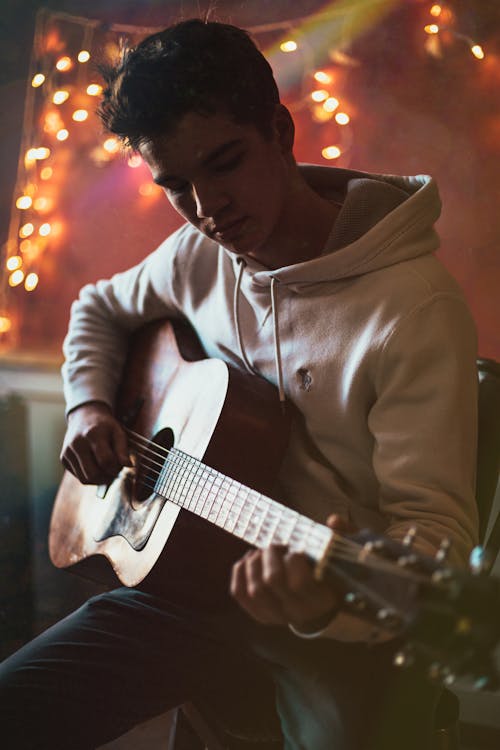A Man Playing Guitar