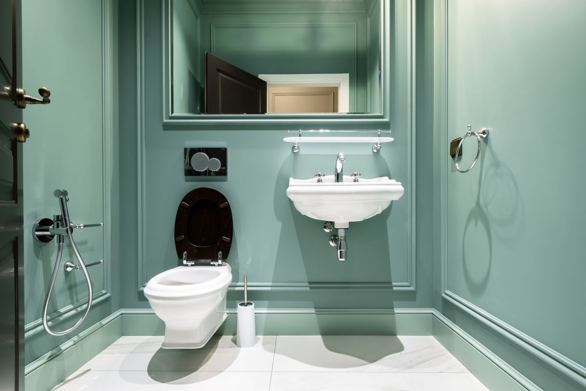 modern green bathroom with natural materials