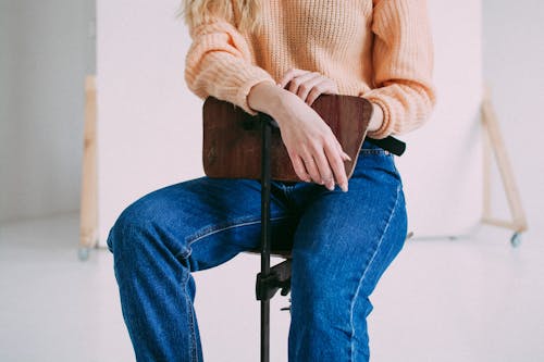 Woman Posing in Sweater and Jeans
