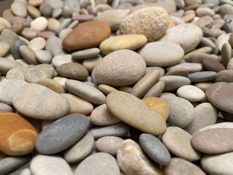 A close-up view of smooth, multi-colored river stones showcasing natural beauty and earthy textures.
