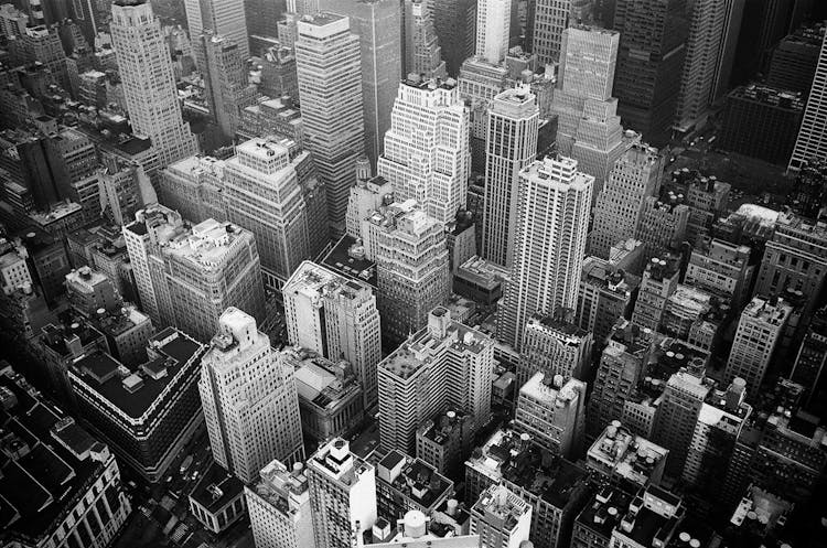 Aerial View And Grayscale Photography Of High-rise Buildings