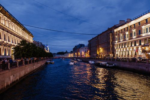Free Twilight scene of a lit canal in St. Petersburg with classic architecture. Stock Photo
